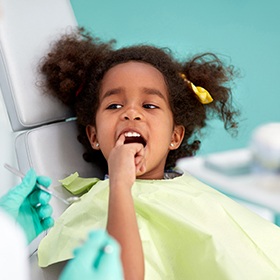 Child pointing at her tooth