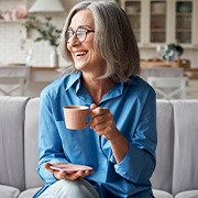 Dentures patient in Goode relaxing with tea