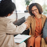 Dentures patient in Goode shaking hands with client