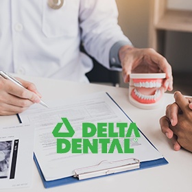 Delta Dental insurance logo over insurance forms